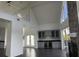 Spacious living room with tall ceilings, clerestory windows, fireplace, and built-in wet bar at 14510 Mj Rd, Myakka City, FL 34251