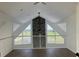 Living room with high vaulted ceilings, fireplace, and scenic backyard pond view at 14510 Mj Rd, Myakka City, FL 34251