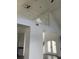 Bright living room with high ceilings and a white staircase, creating an airy and open space at 14510 Mj Rd, Myakka City, FL 34251