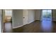 Spacious main bedroom features an ensuite bathroom with a balcony and hardwood flooring at 14510 Mj Rd, Myakka City, FL 34251