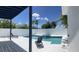 Relaxing backyard pool area featuring a spa, sun loungers, and privacy fencing at 14510 Mj Rd, Myakka City, FL 34251