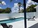 Relaxing backyard pool area featuring a spa, sun loungers, and privacy fencing at 14510 Mj Rd, Myakka City, FL 34251