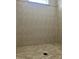 Walk-in shower features neutral tiles with detailed floor design and a window above at 14510 Mj Rd, Myakka City, FL 34251