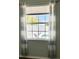 Window view of pool and backyard, framed by curtains at 14510 Mj Rd, Myakka City, FL 34251