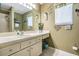 Bright bathroom featuring a shower, a large mirror, and decorative accents, creating a tranquil and inviting space at 15202 Heathridge Dr, Tampa, FL 33625