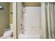 Bright bathroom featuring a tub/shower combination with tile surround and neutral decor at 15202 Heathridge Dr, Tampa, FL 33625