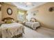 Charming bedroom showcasing two twin beds, window seat, neutral paint and ceiling fan at 15202 Heathridge Dr, Tampa, FL 33625