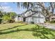 Charming two-story home with a well-maintained lawn and mature trees creating a picturesque curb appeal at 15202 Heathridge Dr, Tampa, FL 33625
