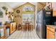 Cozy kitchen nook with a dining table, tiled floors, and stainless steel appliances for convenient meal preparation at 15202 Heathridge Dr, Tampa, FL 33625