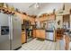 Bright kitchen featuring stainless steel appliances, plenty of cabinetry, and a tiled backsplash at 15202 Heathridge Dr, Tampa, FL 33625
