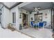 Covered patio with ceiling fan, decorated with patio table and furniture for relaxing outdoors at 15202 Heathridge Dr, Tampa, FL 33625