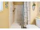 Accessible shower with grab bars and a neutral tile design, offering safety and style in this bathroom at 15202 Heathridge Dr, Tampa, FL 33625