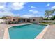 Beautiful backyard with a sparkling pool, patio dining area and screened in back porch at 1546 69Th S Pl, St Petersburg, FL 33705