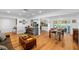 Bright, open living space features a kitchen with bar seating and views of the pool at 1546 69Th S Pl, St Petersburg, FL 33705