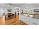 Open floor plan featuring kitchen with modern appliances, a dining area, and living room at 1546 69Th S Pl, St Petersburg, FL 33705