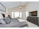 Bright bedroom featuring large window with drapes, cozy bed, and plenty of natural light at 1603 Scotch Pine Dr, Brandon, FL 33511