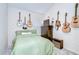 A cozy bedroom features carpeted floors and unique guitar wall decor, creating a personalized space at 1603 Scotch Pine Dr, Brandon, FL 33511