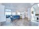 Bright open-concept living space featuring hardwood floors and vaulted ceilings at 1603 Scotch Pine Dr, Brandon, FL 33511