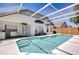 Inviting screened-in pool area with clear blue water, perfect for relaxation and outdoor enjoyment at 1603 Scotch Pine Dr, Brandon, FL 33511