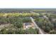 Aerial view showing neighborhood with tree coverage and nearby roadways at 16134 Libourn Ave, Port Charlotte, FL 33954