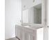Bathroom under construction with double vanity and dual mirrors in bright white and gray tones at 16134 Libourn Ave, Port Charlotte, FL 33954
