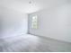 Bright bedroom has wood-look floors, a large window and is ready for personal touches at 16134 Libourn Ave, Port Charlotte, FL 33954