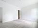 Well-lit bedroom with wood-look flooring, fresh white walls, and natural light from a window at 16134 Libourn Ave, Port Charlotte, FL 33954