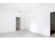 The bedroom has wood-look floors and an open door to what appears to be a bathroom or closet at 16134 Libourn Ave, Port Charlotte, FL 33954