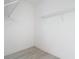 A walk-in closet space features wire shelving and white trim at 16134 Libourn Ave, Port Charlotte, FL 33954