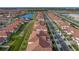 Aerial view of a neighborhood and home featuring a clay tile roof at 17319 Holly Well Ave, Wimauma, FL 33598