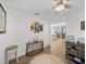 The foyer offers neutral walls, tile flooring, and seamless transition to the home's open layout at 17319 Holly Well Ave, Wimauma, FL 33598