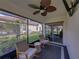 Outdoor patio seating area overlooking backyard and neighborhood at 17319 Holly Well Ave, Wimauma, FL 33598