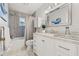 Bathroom features updated vanity and fixtures with decorative shower curtain at 1880 Oak Bark Ct, Clearwater, FL 33763