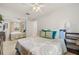 Cozy bedroom showcasing a decorative mirror and a large bed with colorful bedding at 1880 Oak Bark Ct, Clearwater, FL 33763