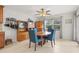 Dining room with tile flooring, wooden dining table, and blue chairs at 1880 Oak Bark Ct, Clearwater, FL 33763