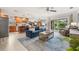 Open-concept living space features a seamless flow to the kitchen and outdoor views at 1880 Oak Bark Ct, Clearwater, FL 33763