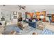 Bright living room with a blue sofa, tile floors, views of the kitchen, and neutral decor at 1880 Oak Bark Ct, Clearwater, FL 33763