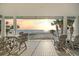 Relax on the covered balcony with ocean views, with outdoor seating for enjoying the sunsets at 2 Gulf Blvd, Indian Rocks Beach, FL 33785