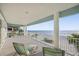 Spacious balcony with chairs offering ocean views, white railings, and plenty of room for relaxing at 2 Gulf Blvd, Indian Rocks Beach, FL 33785