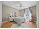 Relaxing bedroom with a rocking chair, balcony access and scenic views overlooking the water at 2 Gulf Blvd, Indian Rocks Beach, FL 33785