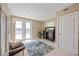 Cozy bonus room features tiled floors, a built-in bar and comfortable seating at 2 Gulf Blvd, Indian Rocks Beach, FL 33785