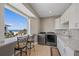 Laundry room with ocean view features a granite countertop, ample cabinetry and counter seating at 2 Gulf Blvd, Indian Rocks Beach, FL 33785