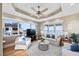 Bright living room with ocean views, recessed lighting, a ceiling fan, and comfortable seating at 2 Gulf Blvd, Indian Rocks Beach, FL 33785