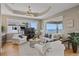 Bright living room with ocean views, tray ceiling, and hardwood floors at 2 Gulf Blvd, Indian Rocks Beach, FL 33785