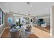 Bright living room showcasing ocean views, stylish furniture, and access to an outdoor balcony at 2 Gulf Blvd, Indian Rocks Beach, FL 33785