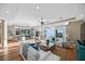 Spacious living room features hardwood floors, comfortable seating, and stunning ocean views at 2 Gulf Blvd, Indian Rocks Beach, FL 33785