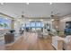 Bright and airy living room showcasing hardwood floors, stylish furniture, and sliding glass doors with ocean views at 2 Gulf Blvd, Indian Rocks Beach, FL 33785