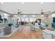 Ocean view living room features a large balcony, hardwood floors, and coastal decor at 2 Gulf Blvd, Indian Rocks Beach, FL 33785