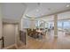 Open living space featuring a dining room, staircase, and window that offer glimpses of the blue water at 2 Gulf Blvd, Indian Rocks Beach, FL 33785