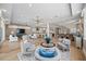Spacious open-concept living space including a kitchen, dining area, and living room with beautiful hardwood floors at 2 Gulf Blvd, Indian Rocks Beach, FL 33785